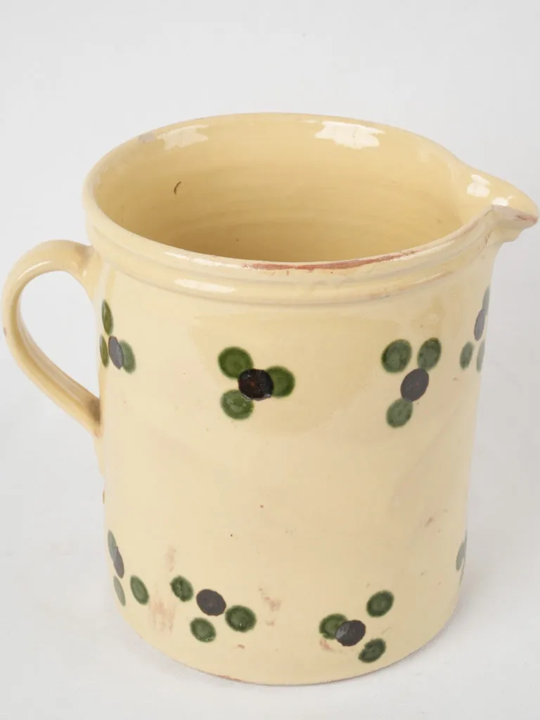 Antique French pitcher - yellow w/ spots 9½"