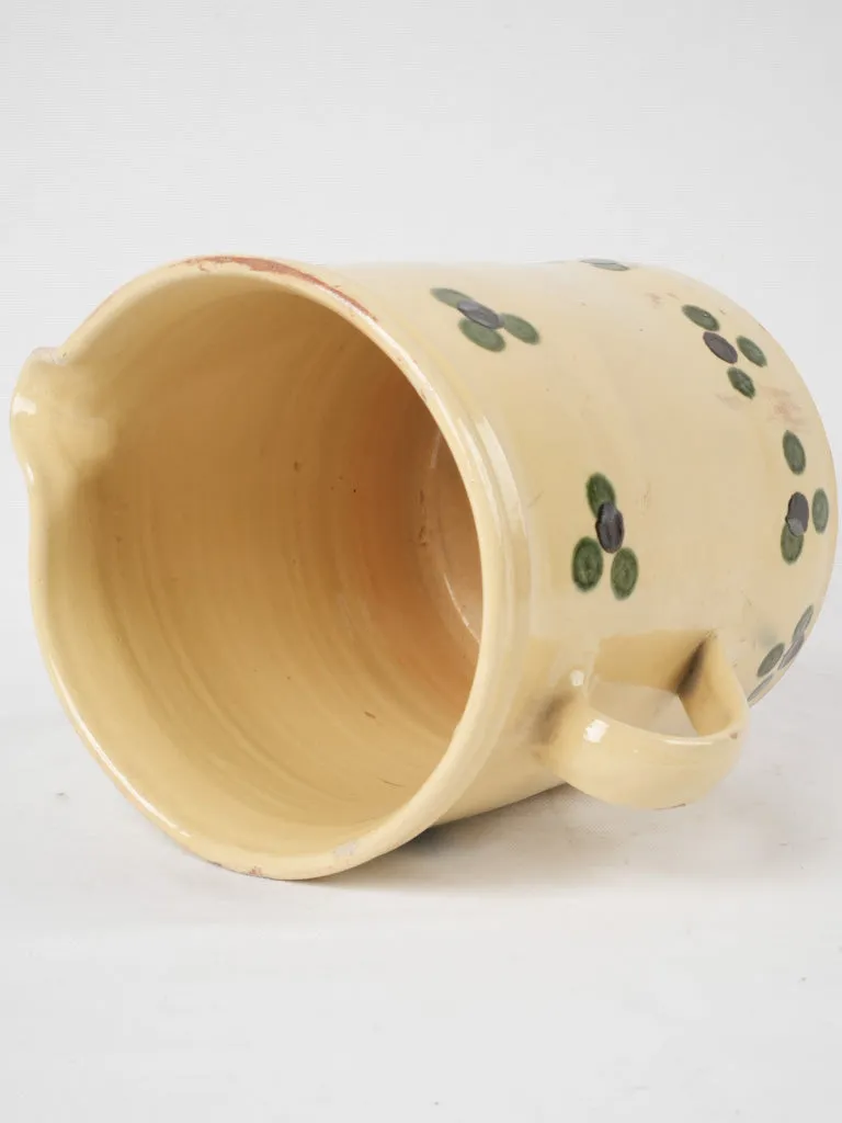 Antique French pitcher - yellow w/ spots 9½"